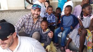 Children who lost parents due to ongoing violence against Christian communities gathered with E3RF team during outreach.